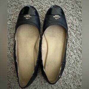 Black leather Coach ballet flats